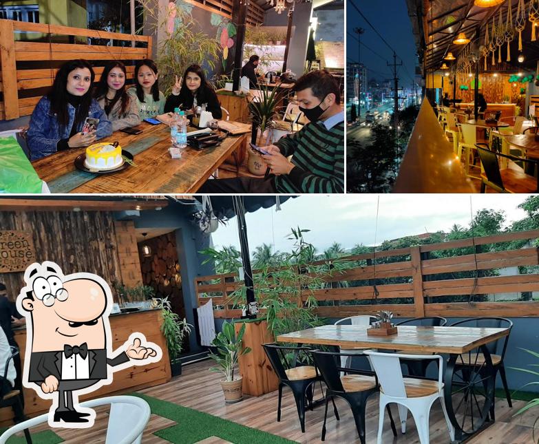 Check out the photo depicting interior and exterior at The Greenhouse Cafe