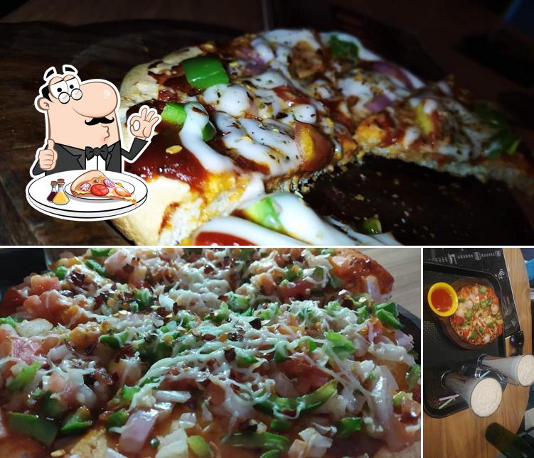 Get pizza at Café Delight