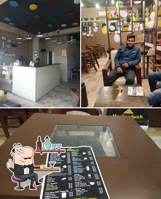 Take a seat at one of the tables at Mr. Sandwich, Bahraich -UP
