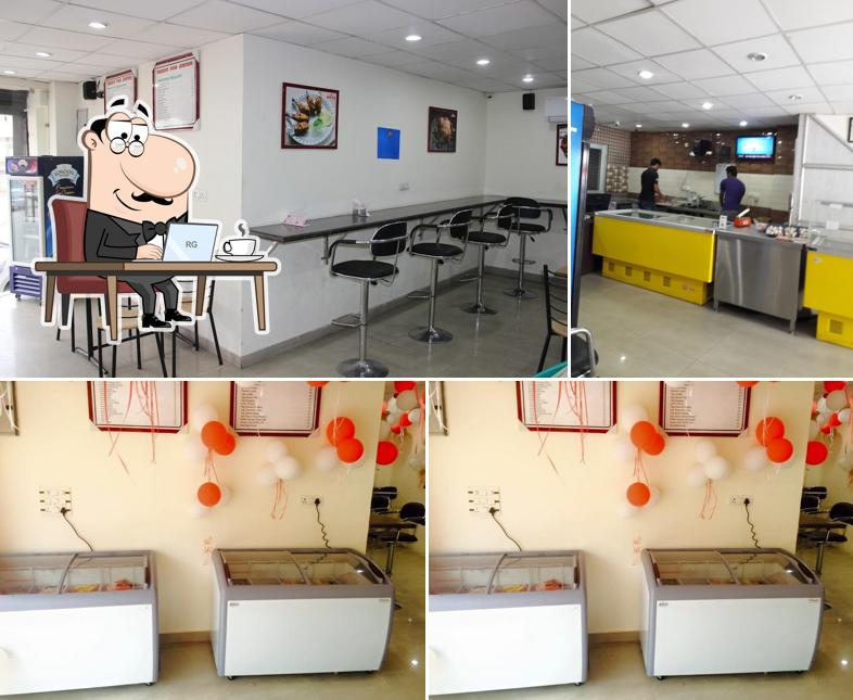 Take a seat at one of the tables at PERFECT FOOD JUNCTION