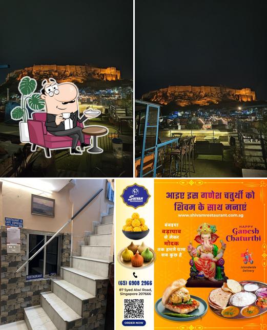 Take a seat at one of the tables at Shivam restaurant & cafe espresso
