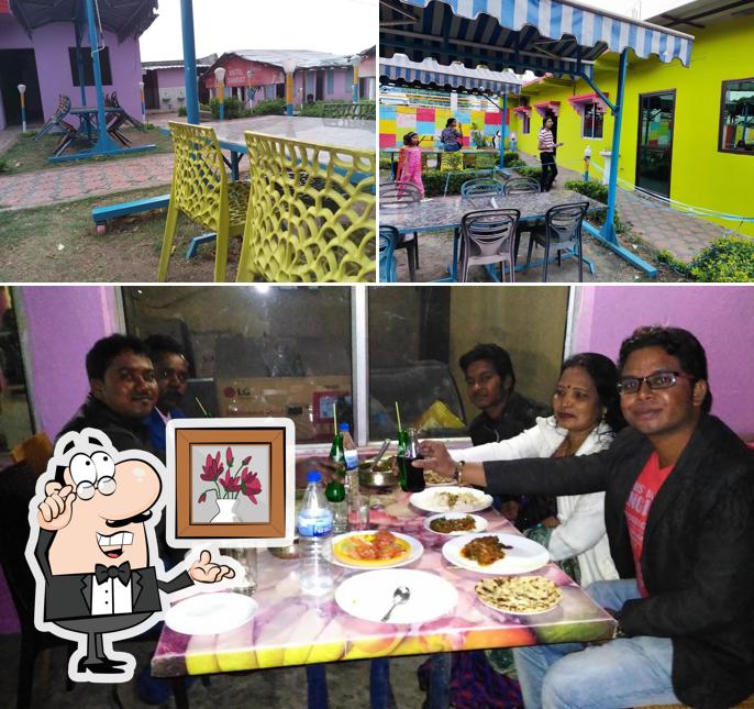 The photo of interior and dining table at The Motel Samrat