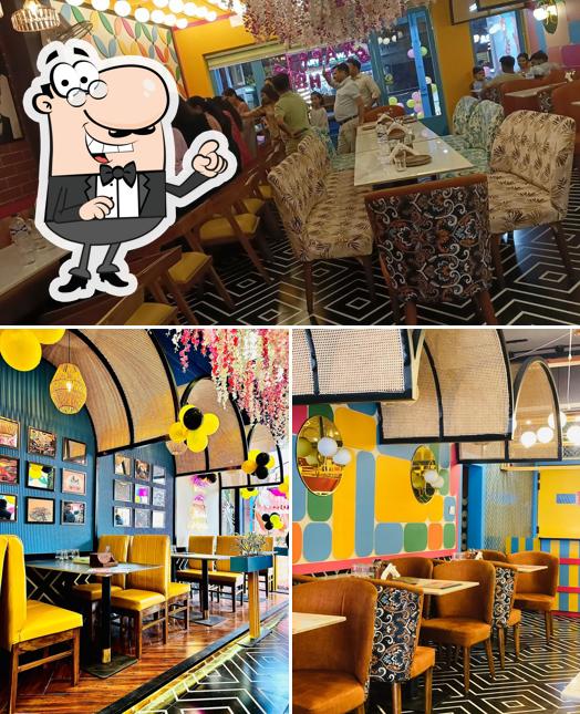 Take a seat at one of the tables at Son of Swaad Aligarh- Best Pure Veg Family Restaurant In Aligarh / Cafe Near AMU