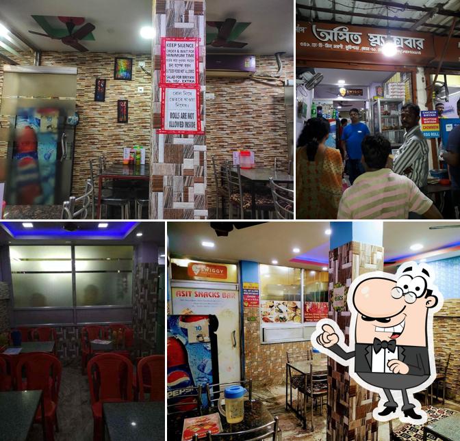 Take a seat at one of the tables at Asit Snacks Bar