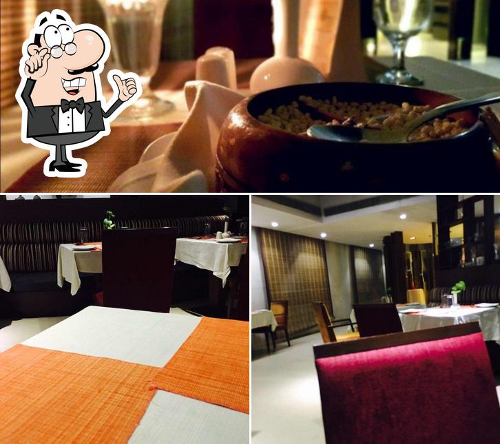 Check out the picture showing interior and dining table at Cilantro