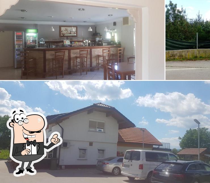 Questa è la immagine che presenta la esterno e tavolo da pranzo di Kriza Bar