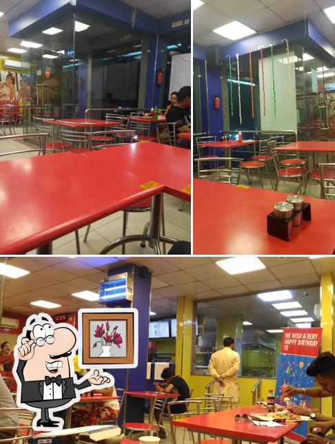 Take a seat at one of the tables at Domino's Pizza Doaba College Chowk, Jalandhar