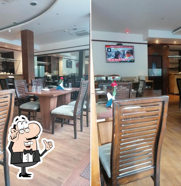 Take a seat at one of the tables at Kian restaurant