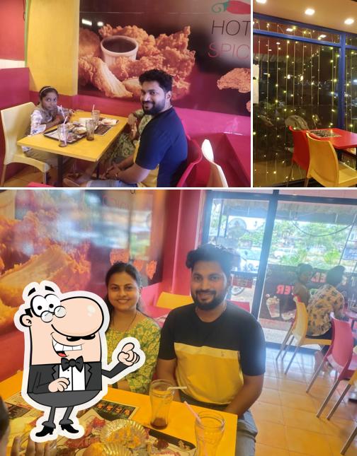 Take a seat at one of the tables at Crispy Delight Kudal