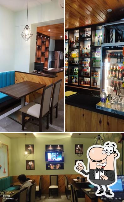 Take a seat at one of the tables at Satkar Family Restaurant & Bar