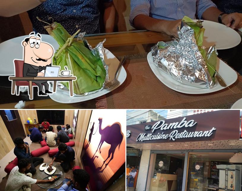 Take a seat at one of the tables at New Pamba Multicuisine Restaurant