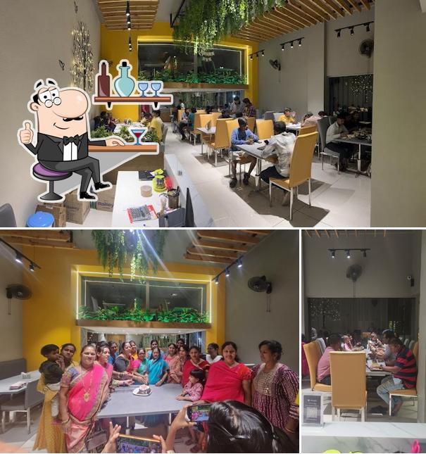 Take a seat at one of the tables at Hotel Ghotilkar Family Restaurant