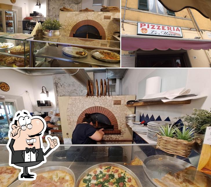 Siediti a un tavolo di Pizzeria Le Mura