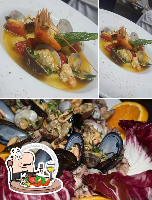 Prenditi la cucina di mare a Ristorante Pizzeria "Lo Scoglio"