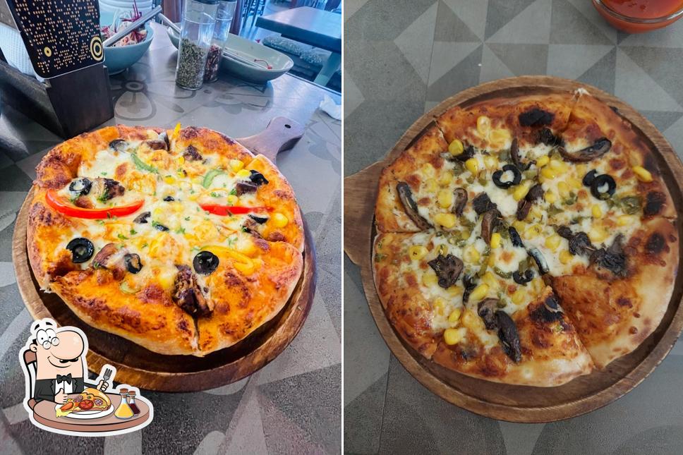 Get pizza at The Firangi Sutra ( vegetarian asian & continental )
