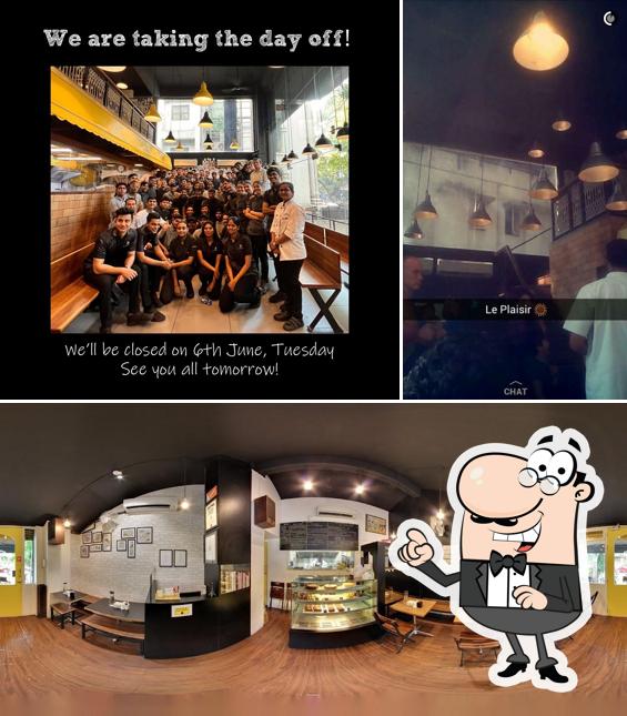 Take a seat at one of the tables at Le Plaisir