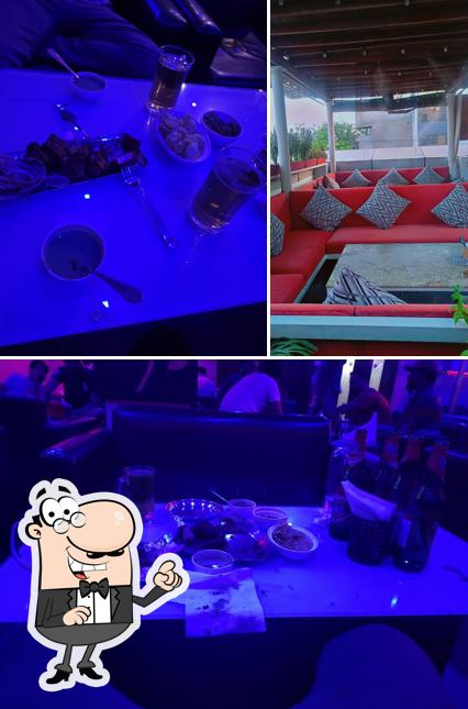 Take a seat at one of the tables at Banera The Lounge And Bar