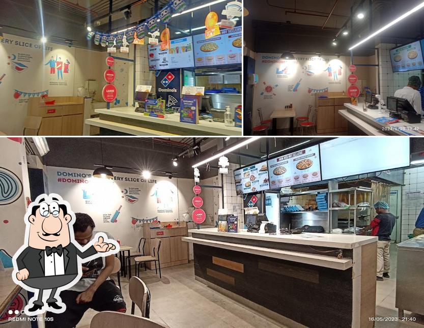 Take a seat at one of the tables at Domino's Pizza Bidhanagar, Durgapur