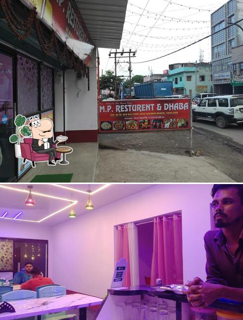 Take a seat at one of the tables at M P RESTAURANT & DHABA