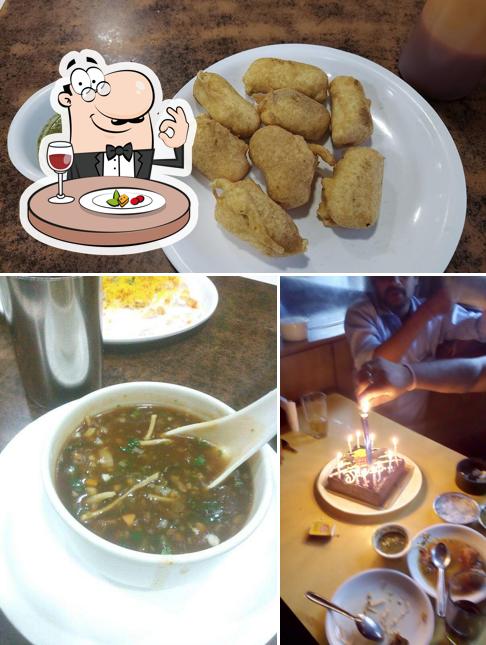 Take a look at the image depicting food and dining table at Hotel Prashant Veg Delight