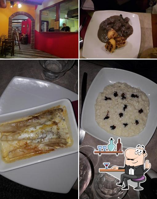 Take a seat at one of the tables at Osteria Succo D'Uva