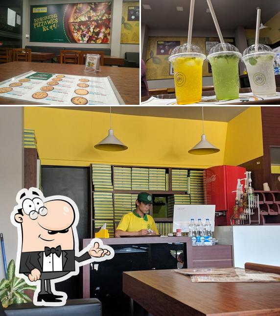 Take a look at the photo depicting interior and beverage at Pizza Ricotta Perinthalmanna