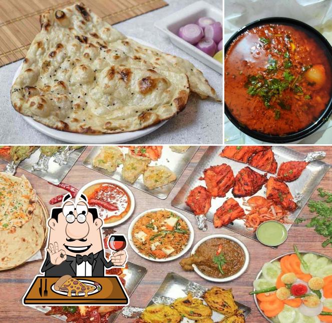 Get pizza at Sai Dhaba Family Restaurant