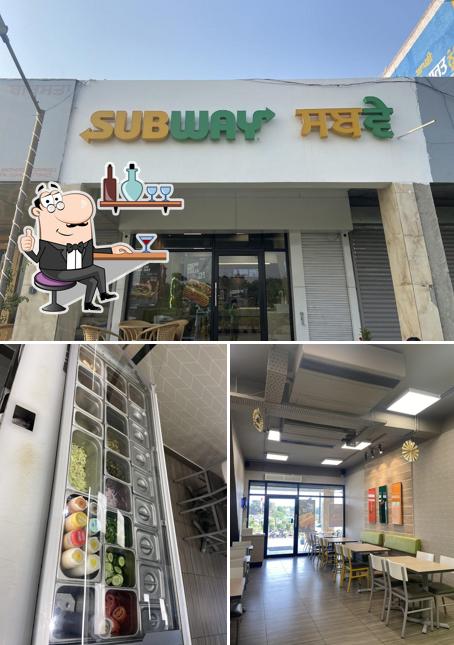 Take a look at the picture depicting interior and food at subway