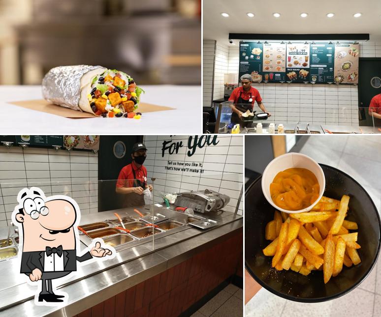 Check out the picture showing interior and food at California Burrito Mexican Kitchen @ Indirapuram