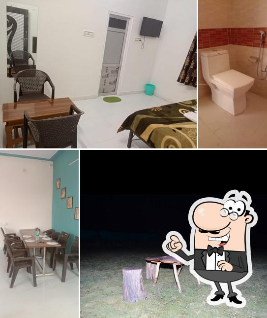 Take a seat at one of the tables at Hotel Ranthambhore Bagh Niwas