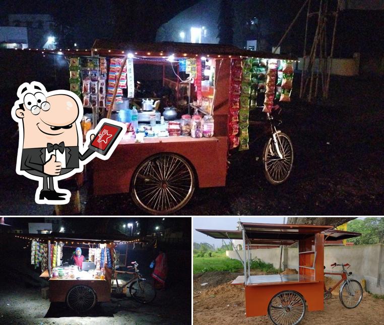 Look at this photo of Famous Food Cart