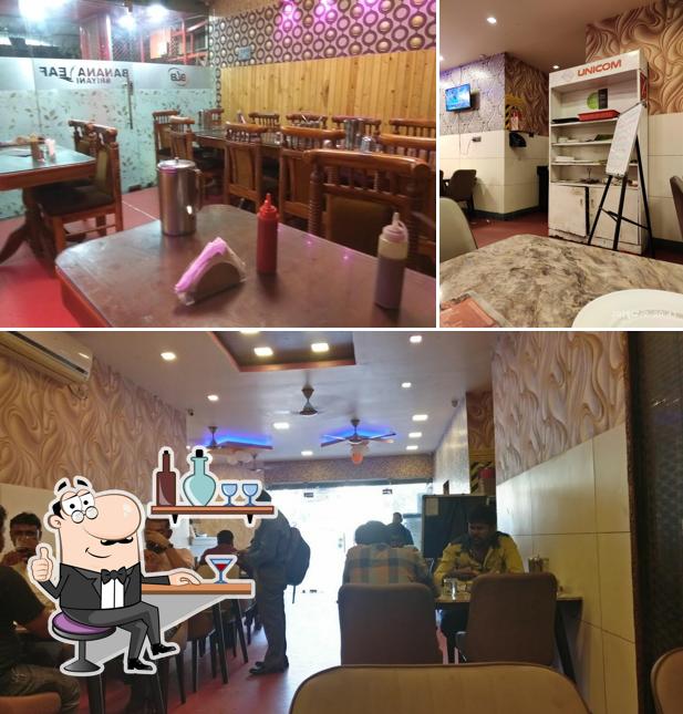 Take a seat at one of the tables at Banana Leaf Biryani & Catering