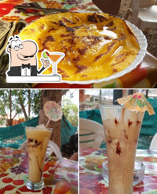 Check out the photo depicting drink and pizza at Organic Cafe an Kerala's Natural Products Supermarket