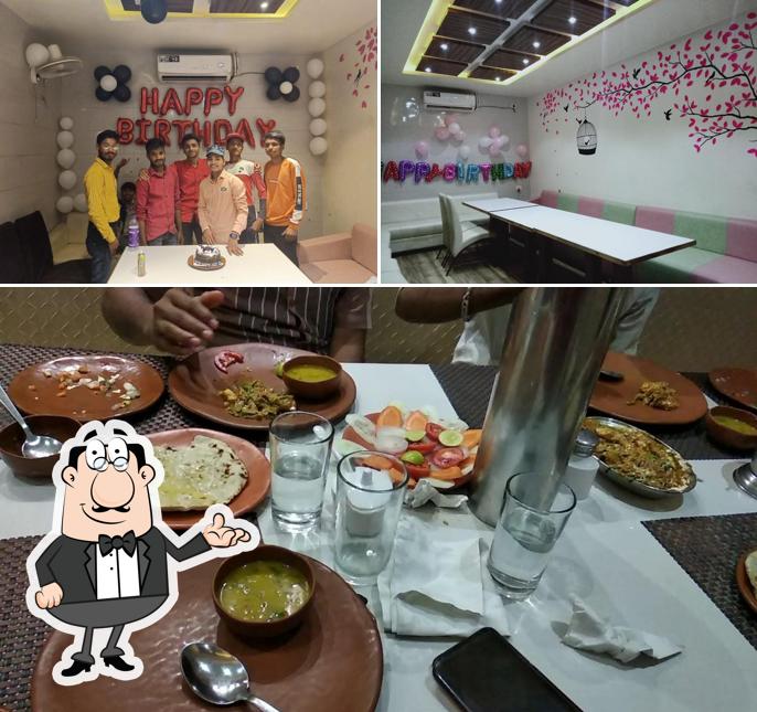 Take a seat at one of the tables at Shriji Restaurant