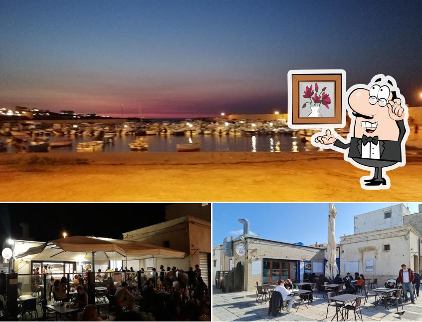 Questa è la foto che raffigura la interni e esterno di Osteria Del Porto