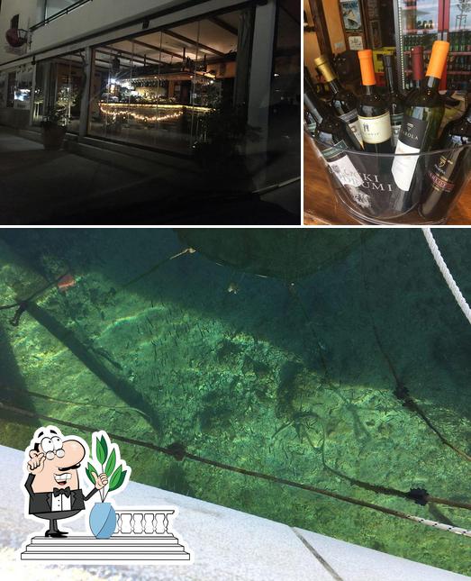Questa è la immagine che presenta la esterno e vino di Caffe Bar Dundo