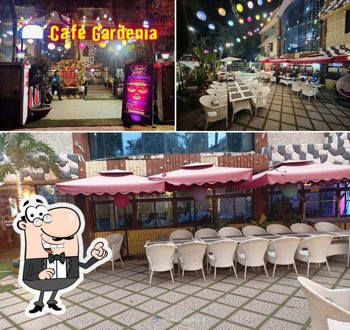 Take a seat at one of the tables at Cafe Gardenia - Restaurant Hotel Party Zone