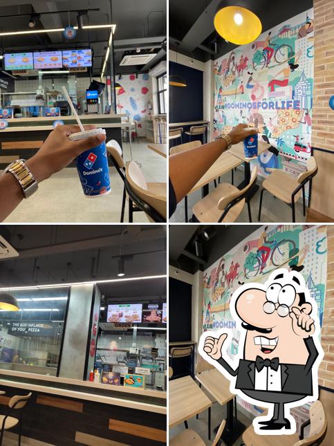 Take a seat at one of the tables at Domino's Pizza Jalnagr, BIJAPUR
