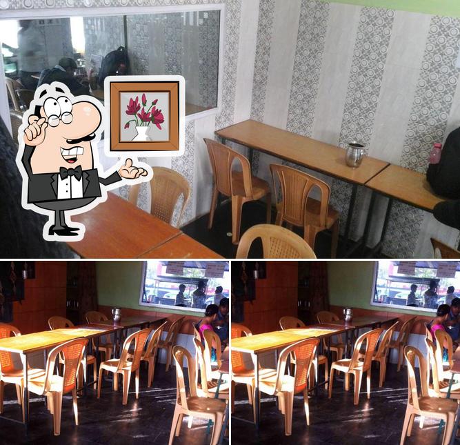 Take a seat at one of the tables at Ajanta Restaurant