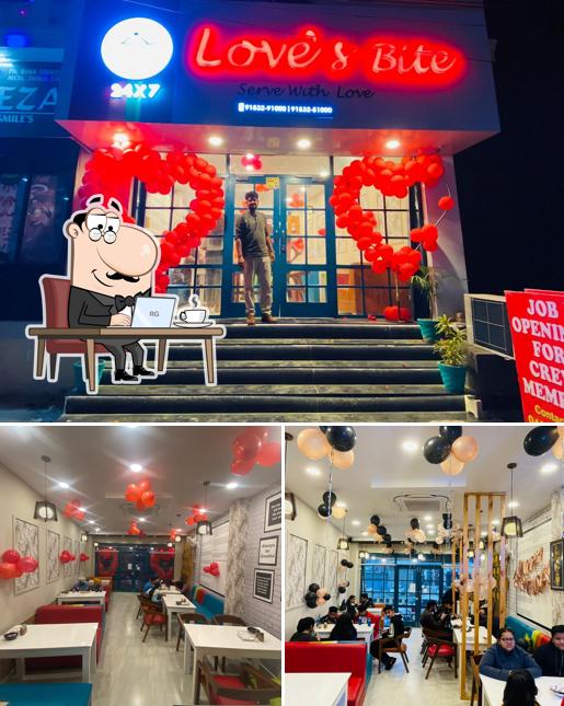 Take a seat at one of the tables at Love's Bite (Serve With Love) 24x7 Open Café I Restaurant