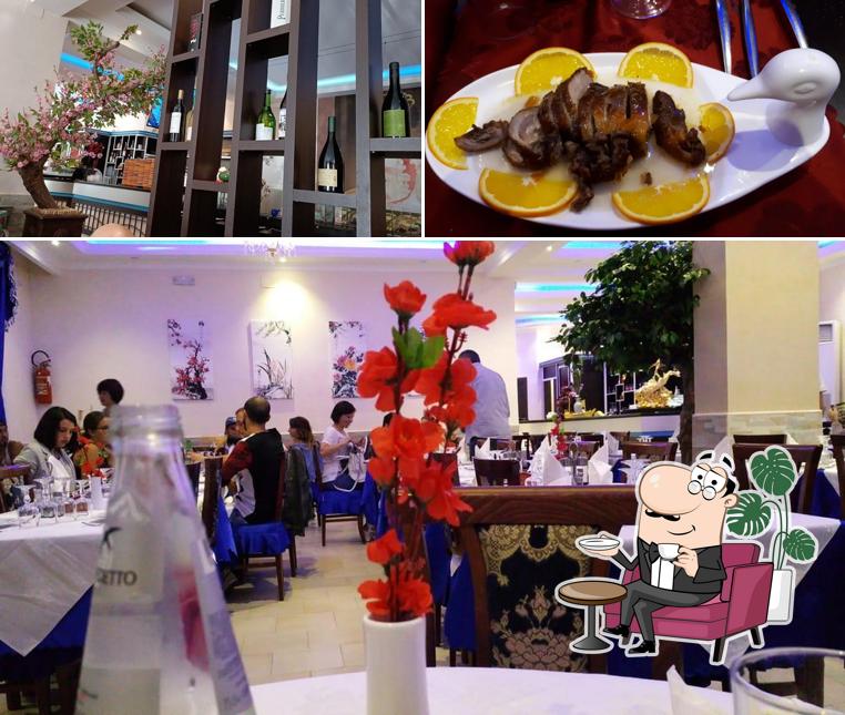 Guarda la foto che mostra la interni e cibo di Ristorante Hong Yun