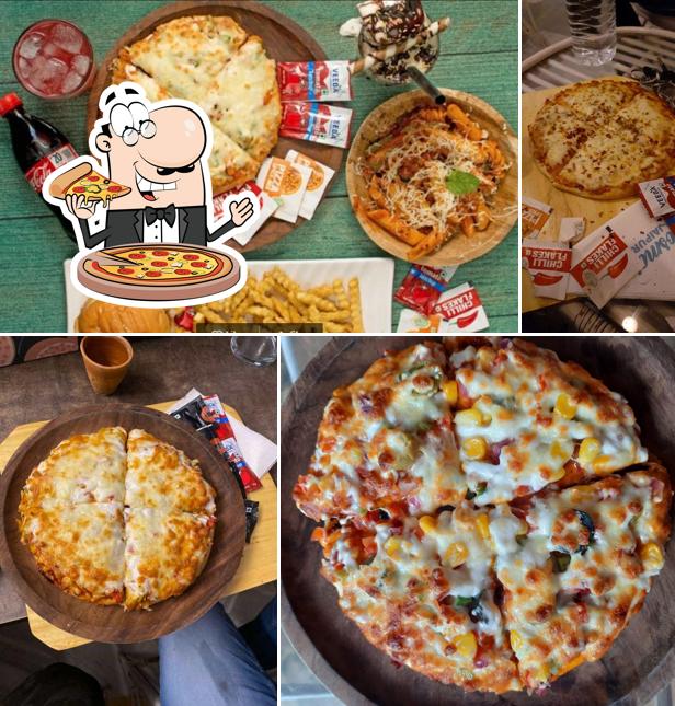 Try out pizza at Cosmos Cafe Mansarovar Jaipur