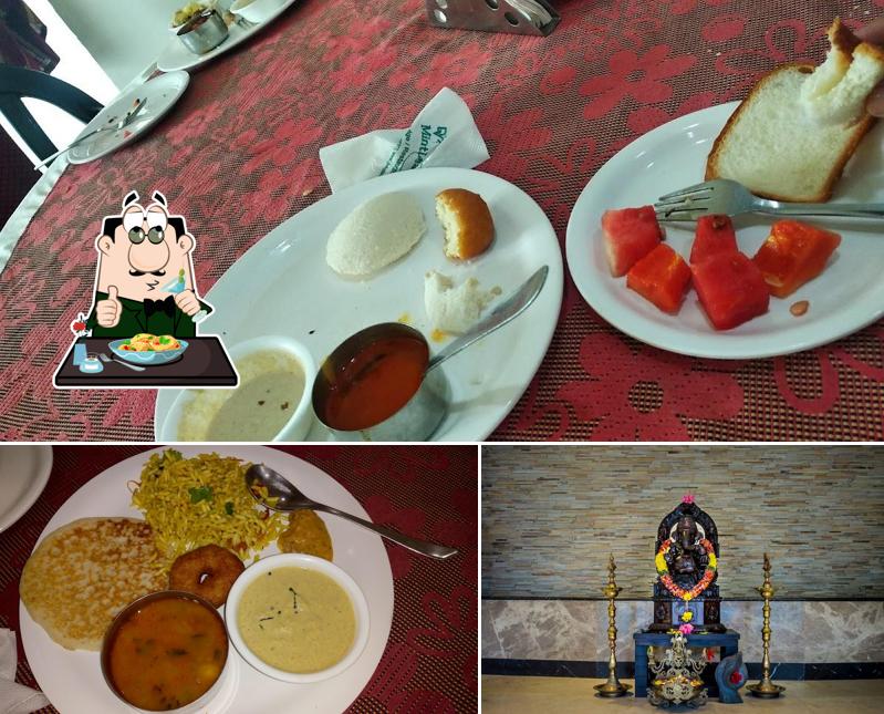 The photo of food and exterior at Hotel DVR Mansion