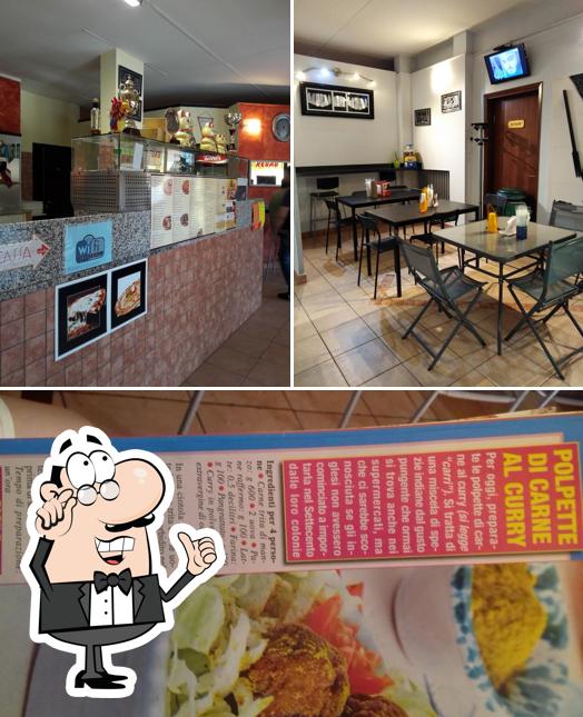 La immagine della interni e cibo di Antica Pizzeria
