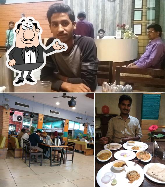 Take a seat at one of the tables at Sanjay Quality Restaurant