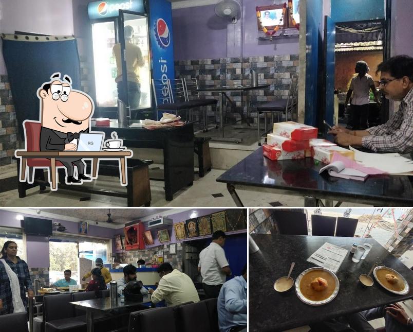 Among different things one can find interior and dining table at Mani's Cafe