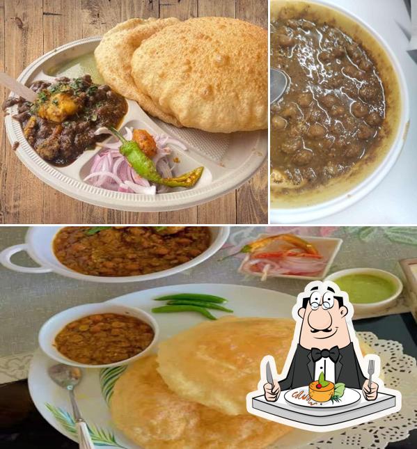 This is the image showing food and interior at Bahu Bhature Wali