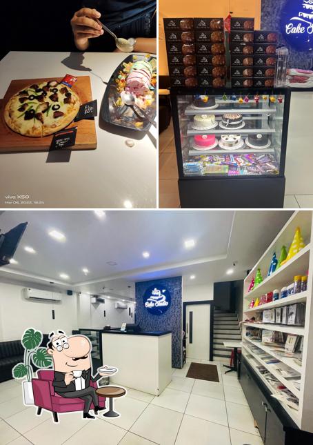 This is the image displaying interior and dining table at Cake Studio Manjeri