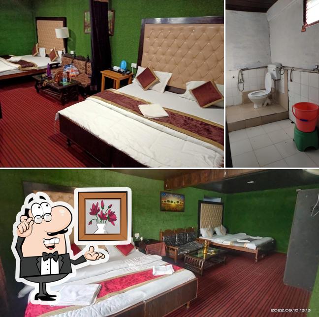 Take a seat at one of the tables at Hotel Kausani Retreat
