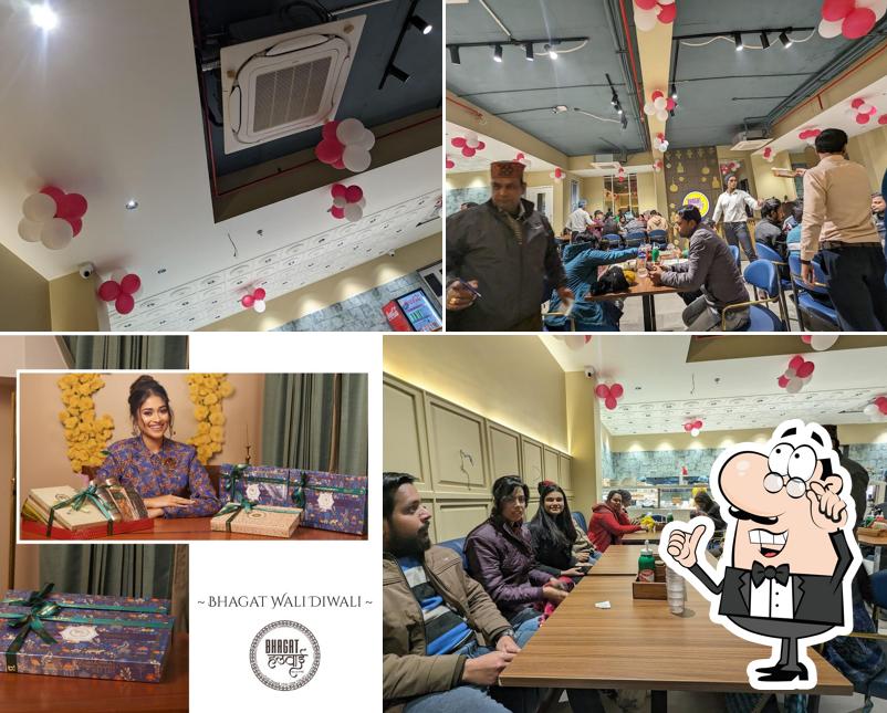 Take a seat at one of the tables at BHAGAT HALWAI Avas Vikas